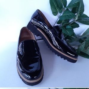 Franco Sarto black patent leather slip on platform loafers w chrome heel accent
